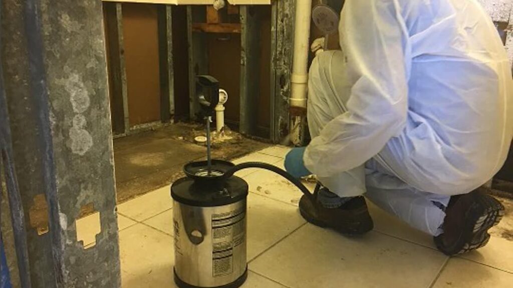 Technician cleaning an air duct to remove dust and improve indoor air quality
