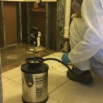Technician cleaning an air duct to remove dust and improve indoor air quality