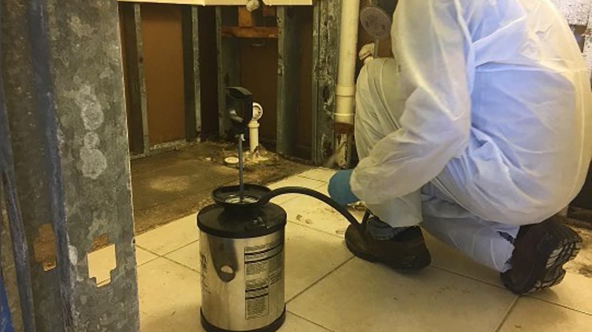 Technician cleaning an air duct to remove dust and improve indoor air quality